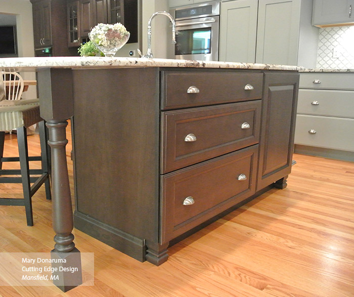 Close-up of dark Cherry kitchen island with the Maxwell cabinet door in Shadow finish
