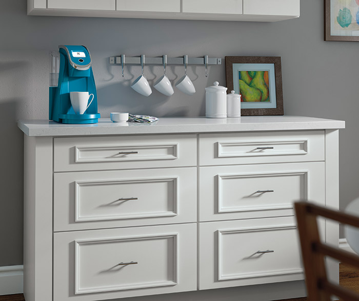 White Atwater cabinets with built-in K-Cup storage