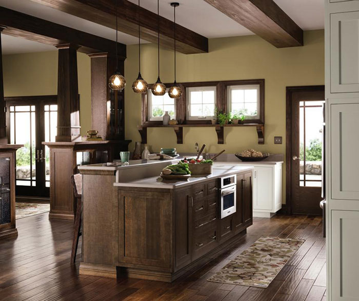 Quartersawn Oak cabinets in a rustic kitchen by Decora Cabinetry