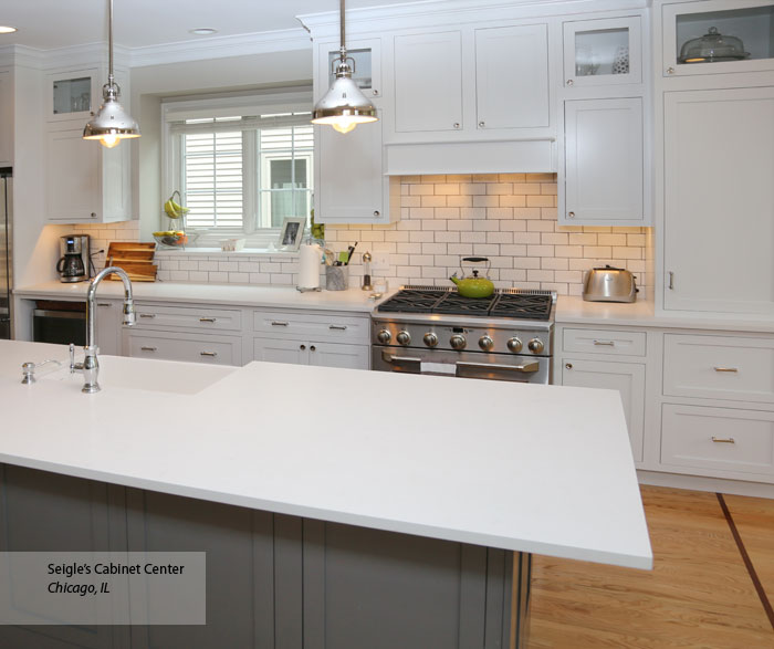White Harmony inset cabinets with a gray kitchen island