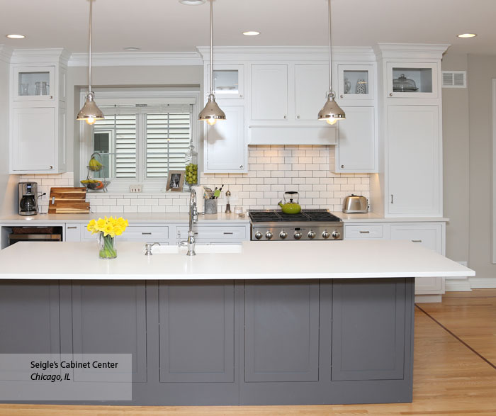 White Harmony inset cabinets with a gray kitchen island