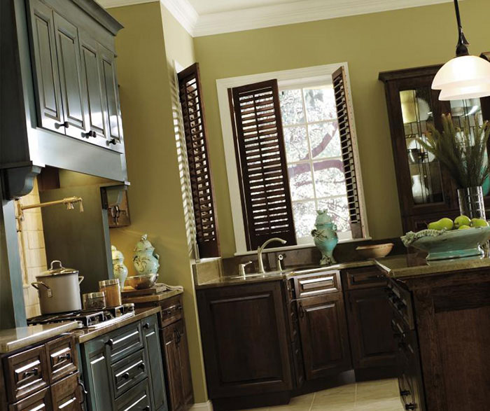 Cherry kitchen with turquoise cabinets by Decora Cabinetry