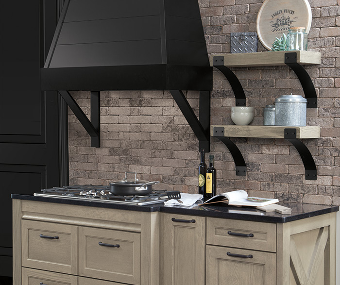 Rustic kitchen design with Tala Quartersawn Oak cabinets and black accents