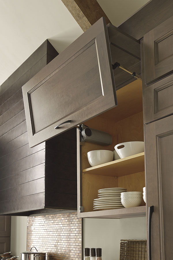 bifold cabinet door hinge with white bowls inside cabinet