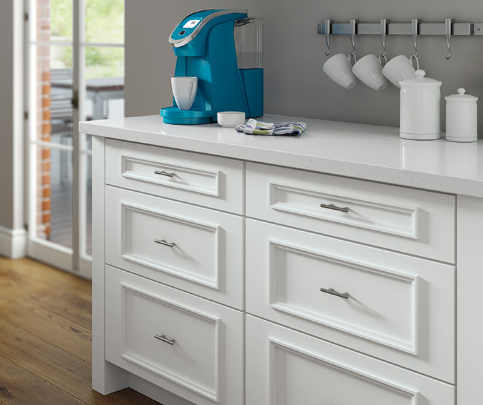 White Atwater cabinets with built-in K-Cup storage