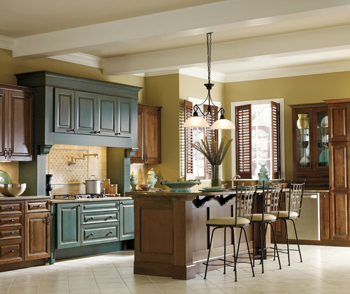 Cherry kitchen with turquoise cabinets by Decora Cabinetry