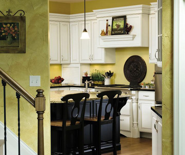 Off white kitchen with black island cabinets by Decora Cabinetry